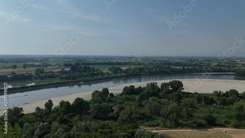 Po River dry riverbed revealing sand banks during extreme drought conditions, showing water crisis and climate change impacts near Cremona and Piacenza, Italy