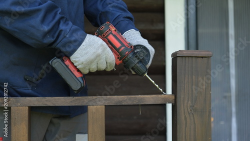 Bilde på lerret Builder worker using cordless hammer drill