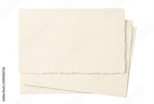 Stack of Textured Cream Paper with Deckled Edge