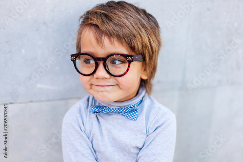 Portrait of smiling little boy wearing oversized spectacles