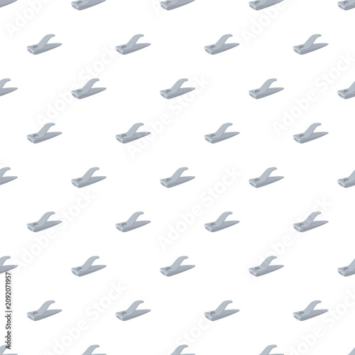 Plakat Repeating nail clippers forming a continuous, clean pattern on a white background