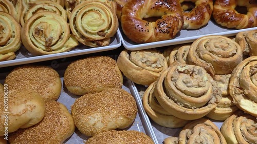 Table full with fresh pastry products. All inclusive breakfast buffet of hotel. Tasty croissants, buns, and muffins at the hotel breakfast buffet. A variety of freshly made pastries and bakery product