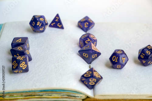 Canvastavla Purple dices scattered across the open blank pages of a vintage handmade sketchb