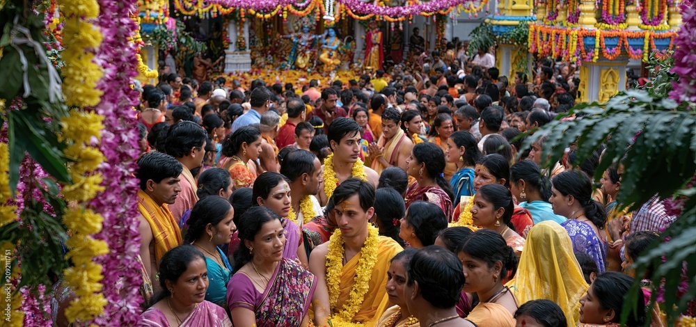 Fototapeta premium Colorful temple scene showcasing lively rituals, traditional clothing, and joyful devotees celebrating Krishna Janmashtami.