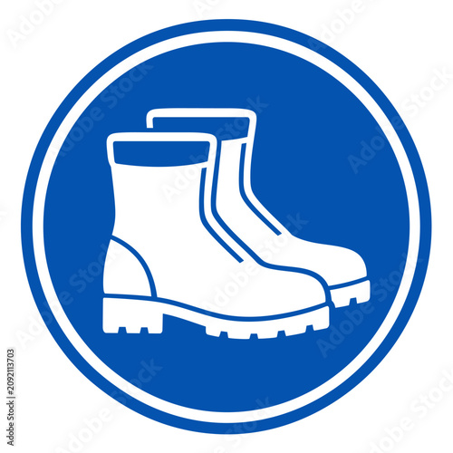 White safety boots icon on blue circular sign.