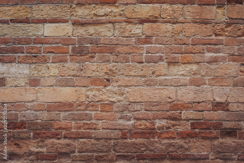 Fototapeta premium Timeless beauty of rustic brick wall showcasing history and character in warm earth tones