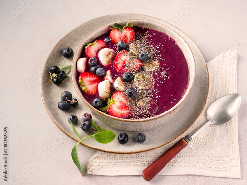 Принти на полотні Smoothie bowl made from homegrown blueberries topped with strawbery, banana, and