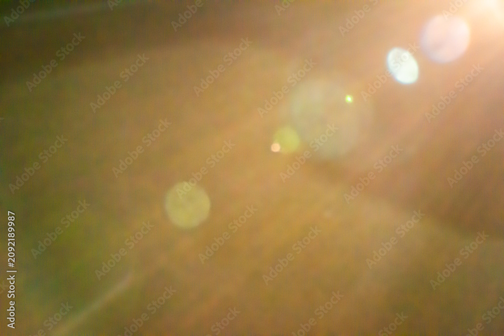 Naklejka premium Warm lens flare overlay with light leaks and bokeh