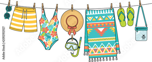 Fotografie Summer beachwear swimwear and vacation accessories hanging on clothesline flat v