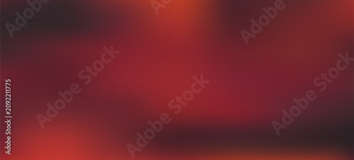 A digital illustration featuring a blurry gradient of dark red, black, and orange hues. The colors swirl and blend seamlessly, creating a textured, abstract effect.