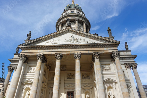 Vászonkép Berlin, Germany, June 8th 2026: The Französischer Dom at Gendarmenmarkt in Berlin rises with refined symmetry, its elegant tower and classical architecture reflecting the French Huguenot heritage