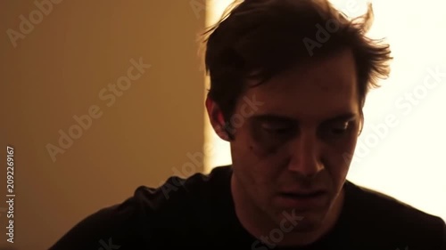 Man with dark circles under eyes, looking tired and stressed