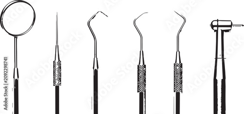 Foto Dental examination instruments with mirror and drill on white background studio