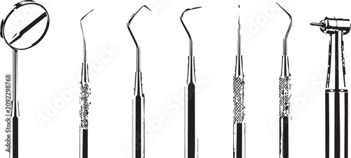Fotografija Dental examination tools arranged in a line against a white background