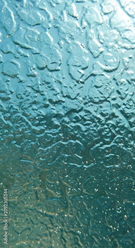Abstract texture of frosted glass with water droplets effect.