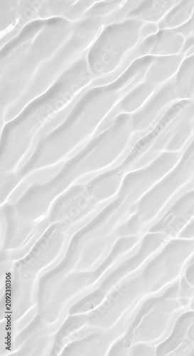 Abstract white textured surface with flowing wave patterns.