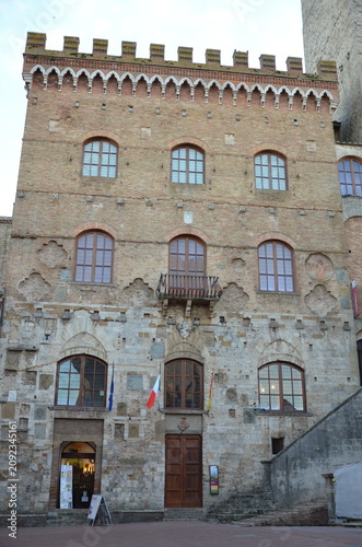 San Gimignano, Italy 03.04.2020: Town Hall (also known as the Palazzo del Popolo or Palazzo Nuovo del Podestà) and the Torre Grossa in San Gimignano