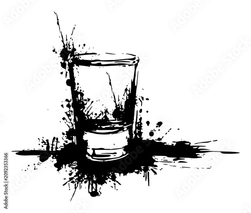 Obraz na płótnie Shot glass for vodka or whiskey with artistic grunge ink splatters and liquid sp