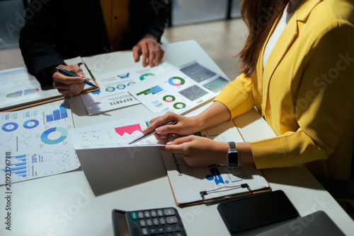 Business people analyzing financial data reports for strategy