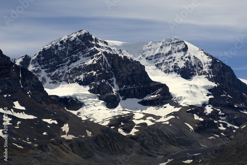 Fotografija The Colossal Snow-Covered Face of Mount Andromeda Rising Above the Glacial Valle