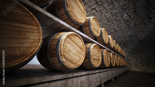 Fotografía Stocked wine barrels across two sides of corridor of a wine cellar