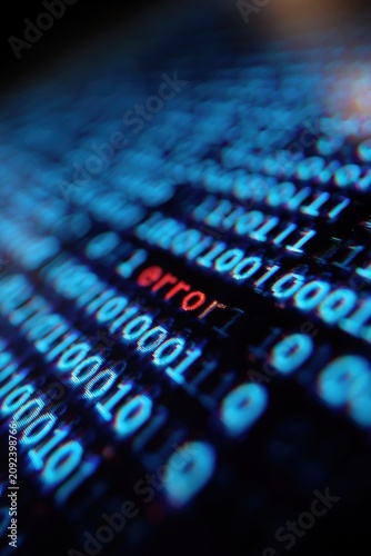 Binary code showing error message on blurred digital screen