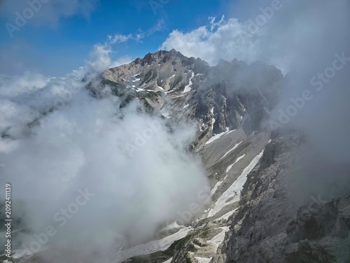 Scenic view of Monte Prena peak enveloped in low clouds, Gran Sasso National Park, Abruzzo, Italy