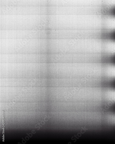 Blank grained film strip texture background with heavy grain, dust and light leak