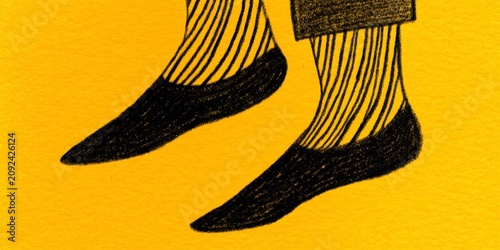 closeup of feet in socks, drawing on a yellow background