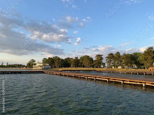 Wooden Piers on the Lake Overlooking Waterfront Park and Buildings