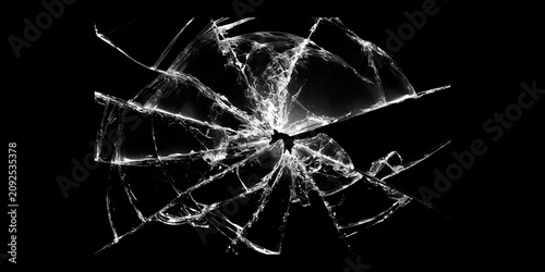 Shattered glass crack pattern isolated on black background, broken window texture with spiderweb fracture lines, abstract damage effect for design, impact and destruction concept
