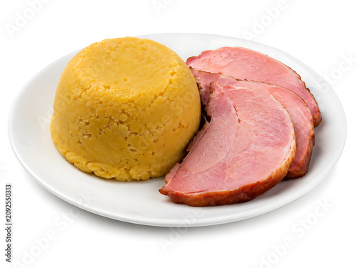 @
 Pease pudding, traditional English yellow split pea pudding molded into a dome, served with ham slices