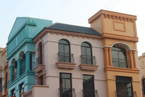 Obraz na płótnie Close up shot of European style colonial architecture with pastel colored facades