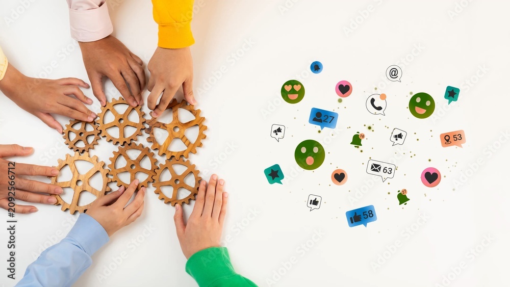 Obraz premium Collaborative Hands Connecting Gears and Social Media Icons Representing Teamwork, Communication, and Digital Engagement in Modern Work Environment Gluon.