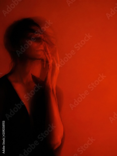Ethereal motion blur portrait of a woman touching her face, shadowy figure with ghosting effect against intense monochromatic fiery red background, conceptual mental health imagery