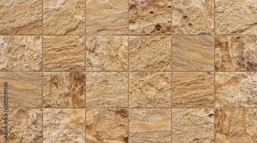 Travertine tile wall a square grid of natural stone slabs with layered textures and earthy tones