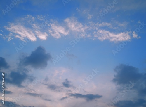 Cuadro en lienzo Soft stratocumulus formations illuminated by gentle low‑angle sunlight after rai