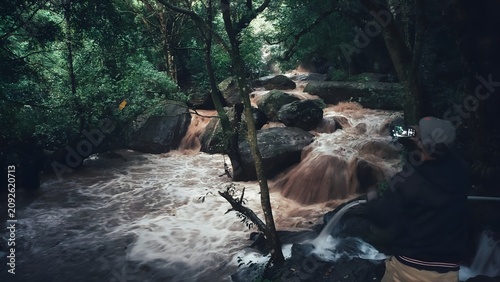 Canvas Print Wild Monsoon Waterfall Flowing Through Dense Tropical Forest