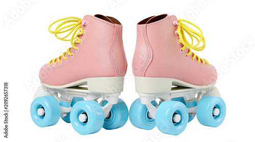 Pair of pink roller skates with yellow laces and blue wheels, isolated on transparent background