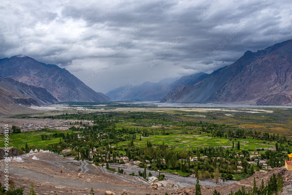 Fototapeta premium Panoramic view of green fields and villages in Nubra Valley, Ladakh