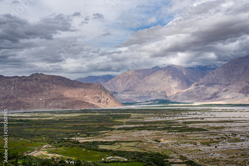 Konstfotografi Wide panorama of Nubra Valley under a stormy sky, Ladakh