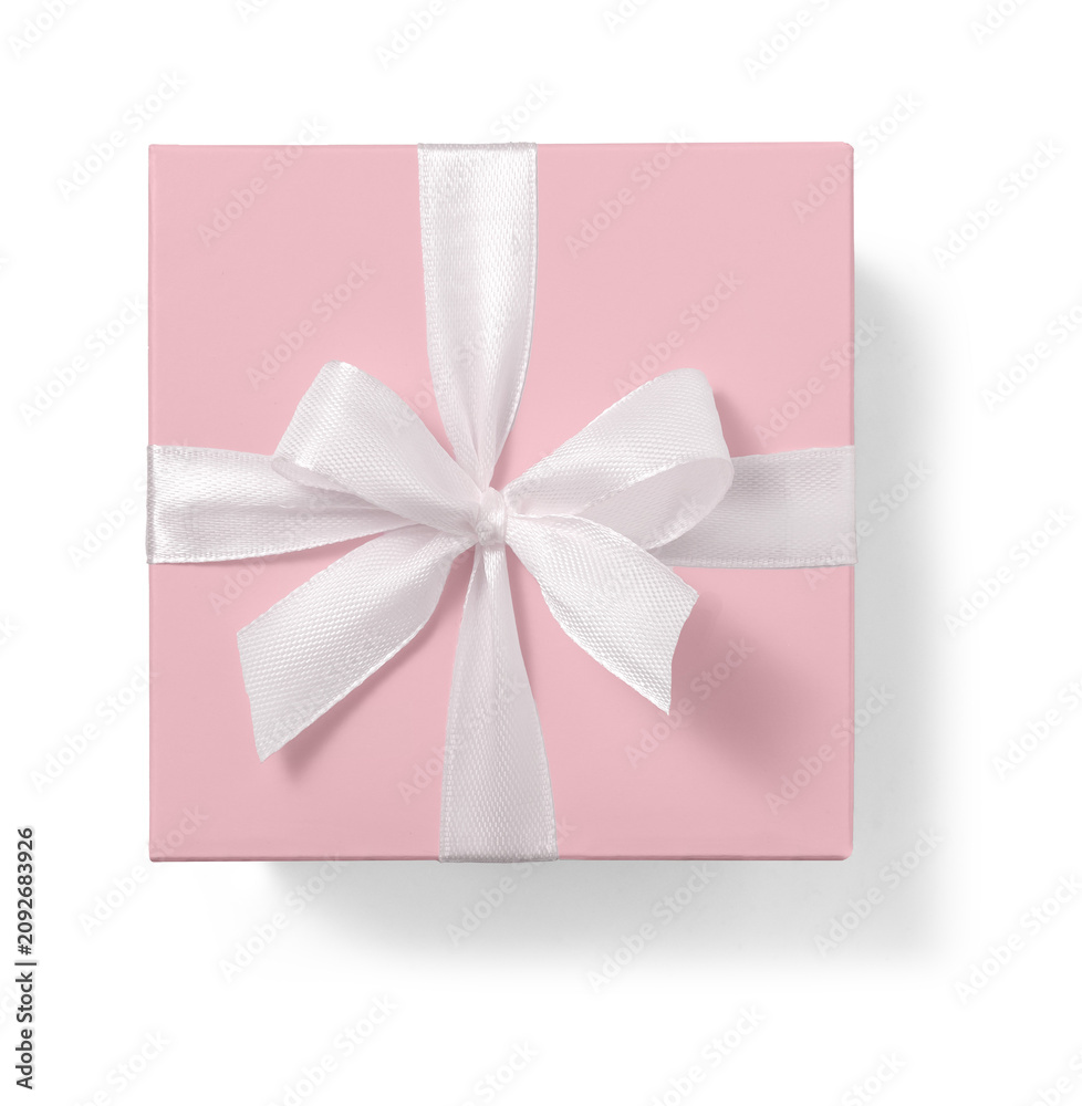 Fototapeta premium Pink gift box with white bow isolated on white background. Top view. Flat lay.