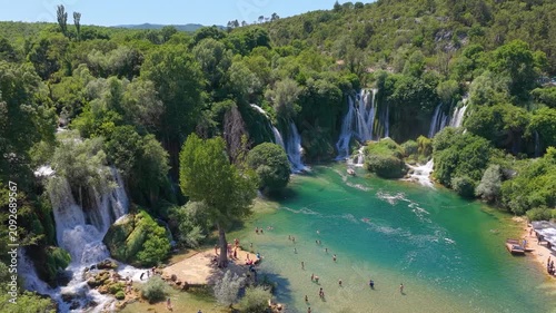 Kravica Waterfall, Bosnia and Herzegovina - June 7, 2026: Elevated drone view of visitors at the iconic Kravica Waterfall