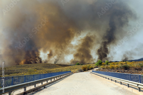 Konstfotografi A devastating wildfire fueled by an intense heatwave burns through dry vegetation in Los Gallardos in Almeria province southern Spain destroying homes and threatening communities on July 10 2026