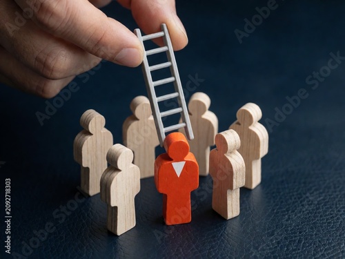 Hand Placing Ladder Above Orange Business Figure