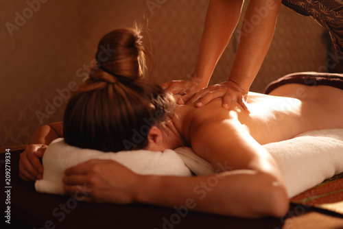 Konstfotografi Relaxing thai massage session with therapeutic touch on back