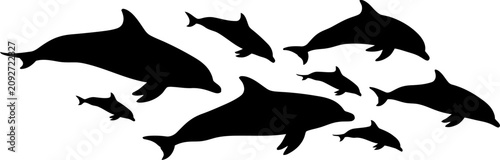 Canvastavla Group of black dolphin silhouettes swimming in a pod with silhouette swimming wi