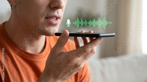 Man using voice recognition assistant on smartphone