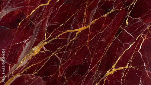 Luxurious deep red marble texture with intricate golden veins, offering a sophisticated abstract background for premium design projects, elegant wallpaper, and rich backdrops with ample copy space