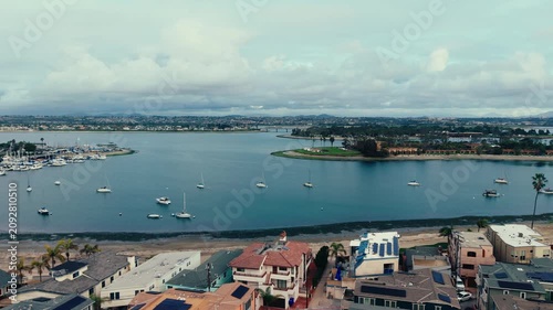 Aerial drone panorama of Mission Bay marina with calm water boats and waterfront in San Diego California landscape